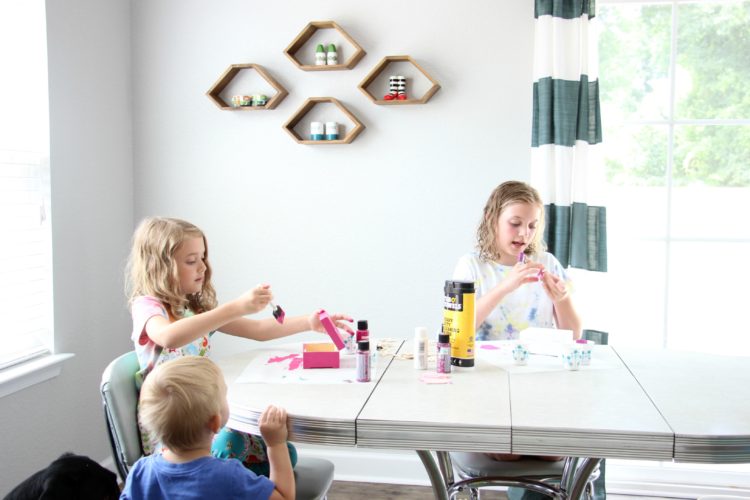 This darling DIY jewelry box is just the right size to organize earrings and rings. These $1.99 boxes are fun to paint and customize and are great for kids! Roll felt around crayons and place them close together to create the spaces for jewelry