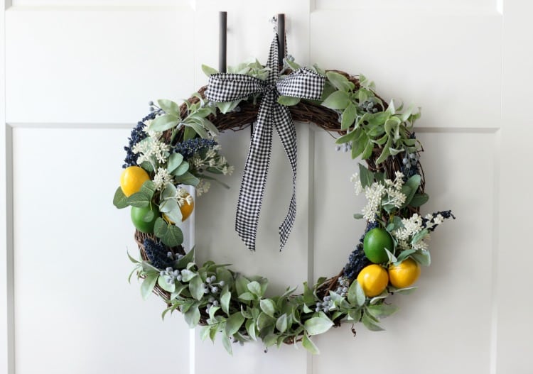 Bright pops of citrus combine with greenery and gingham for an adorable & easy wreath to make this summer!