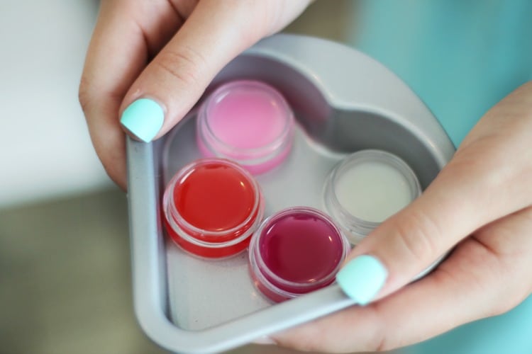 This colorful crayon lip gloss is made from coconut oil and crayons. That's it! Such a simple activity for kids to make. You can add scents if you'd like and make them any color of the rainbow depending on what color of crayon you choose!