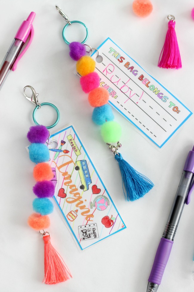 Make a pom pom key chain to accessorize your back pack this year! With a printable name tag to color, it is a fun and personalized way to label your bag!