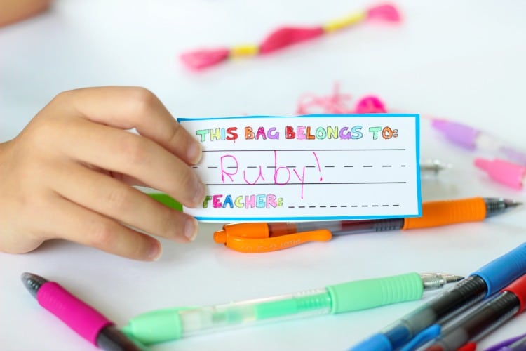 Make a pom pom key chain to accessorize your back pack this year! With a printable name tag to color, it is a fun and personalized way to label your bag!