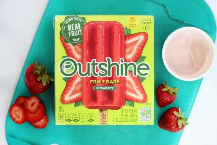 These real strawberry fruit bars are dipped in low-fat strawberry banana yogurt and topped with a fresh strawberry slice. It's like a smoothie on a stick!