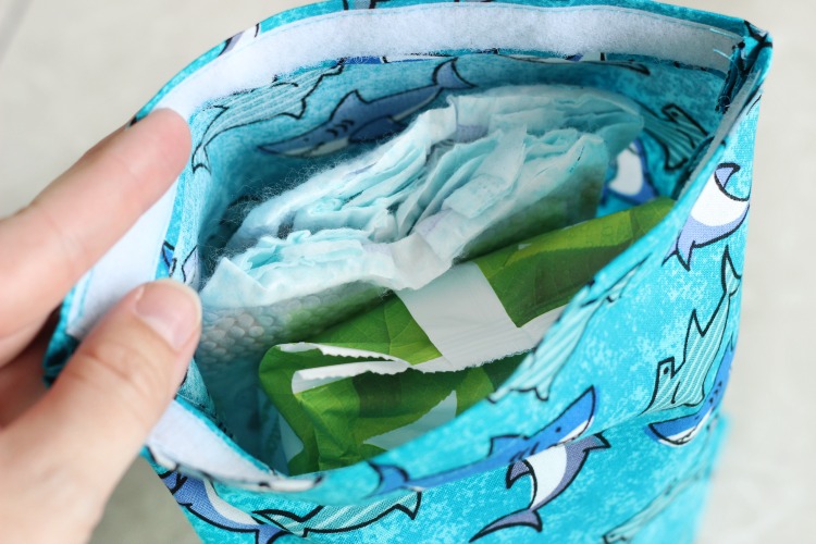 This DIY diaper changing clutch is an easy 15-minute sewing project. It holds 3 diapers, a package of wipes, and even has room for diaper cream or other small items! Every mom needs one so make a few to keep on hand as baby shower gifts! 