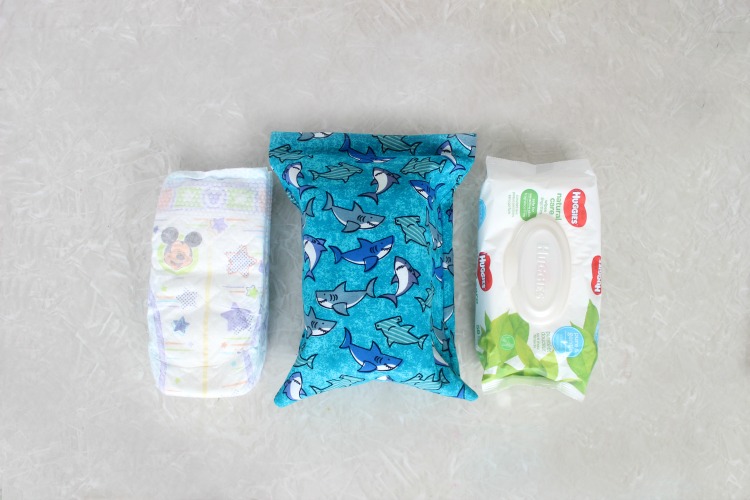 This DIY diaper changing clutch is an easy 15-minute sewing project. It holds 3 diapers, a package of wipes, and even has room for diaper cream or other small items! Every mom needs one so make a few to keep on hand as baby shower gifts! 