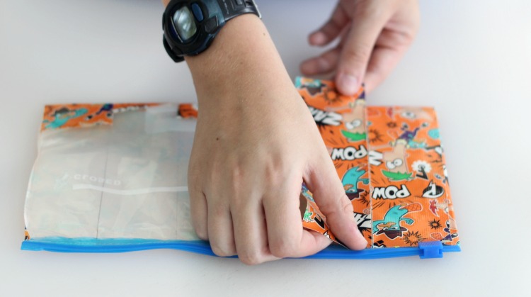 A DIY duct tape zipper pouch is useful for so many things! Fill it with pencils, markers, toiletries, or use as a diaper clutch! Grab a gallon sized plastic baggie and a roll of duct tape and you're set!