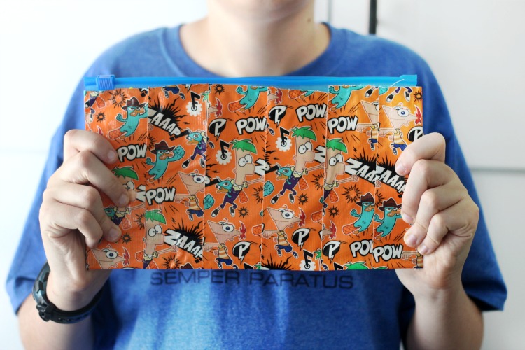 A DIY duct tape zipper pouch is useful for so many things! Fill it with pencils, markers, toiletries, or use as a diaper clutch! Grab a gallon sized plastic baggie and a roll of duct tape and you're set!
