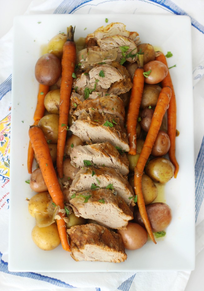 A delicious marinated pork tenderloin with root vegetables that takes 10 minutes to prep and slow cooks all day to perfection. The perfect weeknight meal after a busy day!