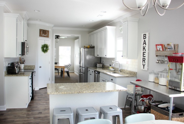 Transform your kitchen with a $35 subway tile backsplash using wallpaper! This peel and stick wallpaper is inexpensive and easy to work with! 