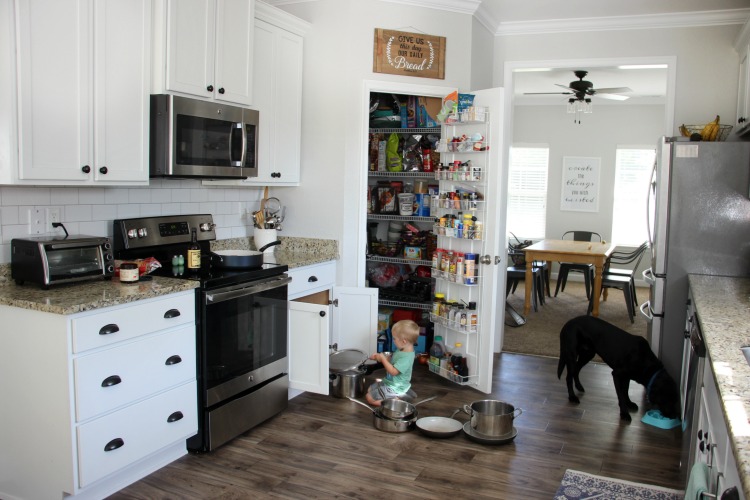 Transform your kitchen with a $35 subway tile backsplash using wallpaper! This peel and stick wallpaper is inexpensive and easy to work with! 