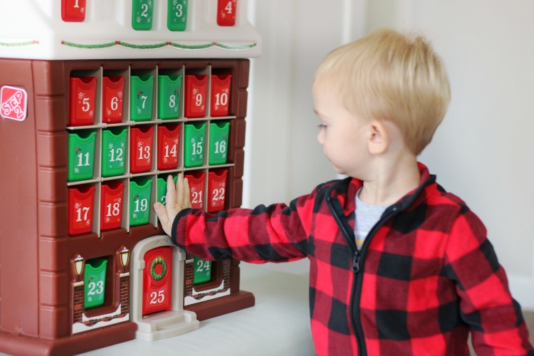 toddler playing with advent