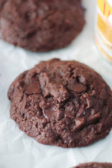 Chocolate pumpkin cookies next to can of pumpkin puree.