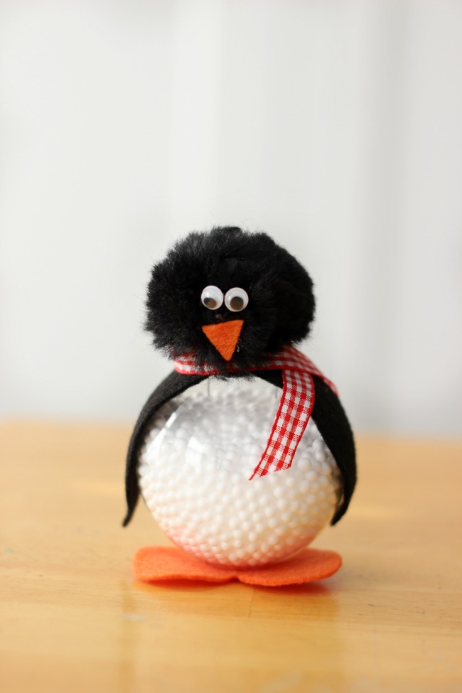 Make a darling penguin craft out of a clear ornament! Add a hanger to use during the holidays, or keep it on a shelf. Kids will love making these cute penguins this winter!