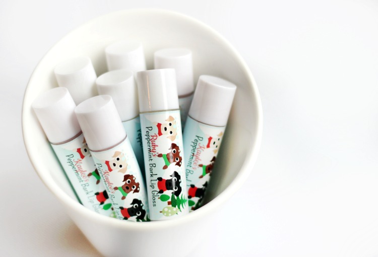 Peppermint bark scented homemade lip balm with cute holiday wrappers! An easy project for kids to help with and they make great holiday gifts!