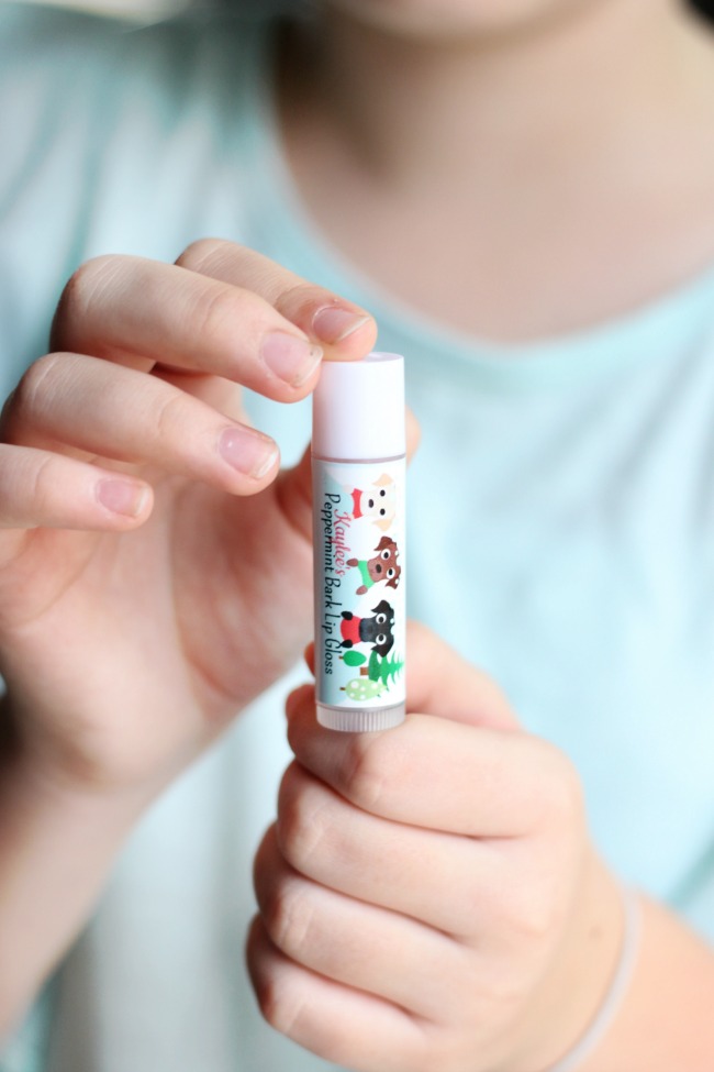 Peppermint bark scented homemade lip balm with cute holiday wrappers! An easy project for kids to help with and they make great holiday gifts!