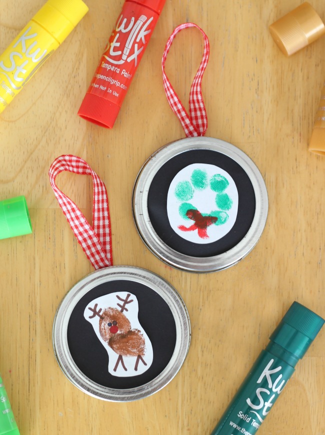 reindeer ornaments made from thumbprints and canning jar lids