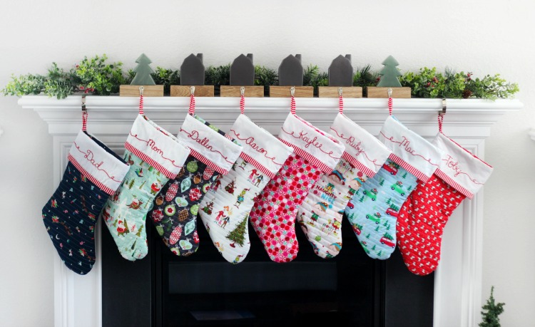 8 stockings hanging on a mantel