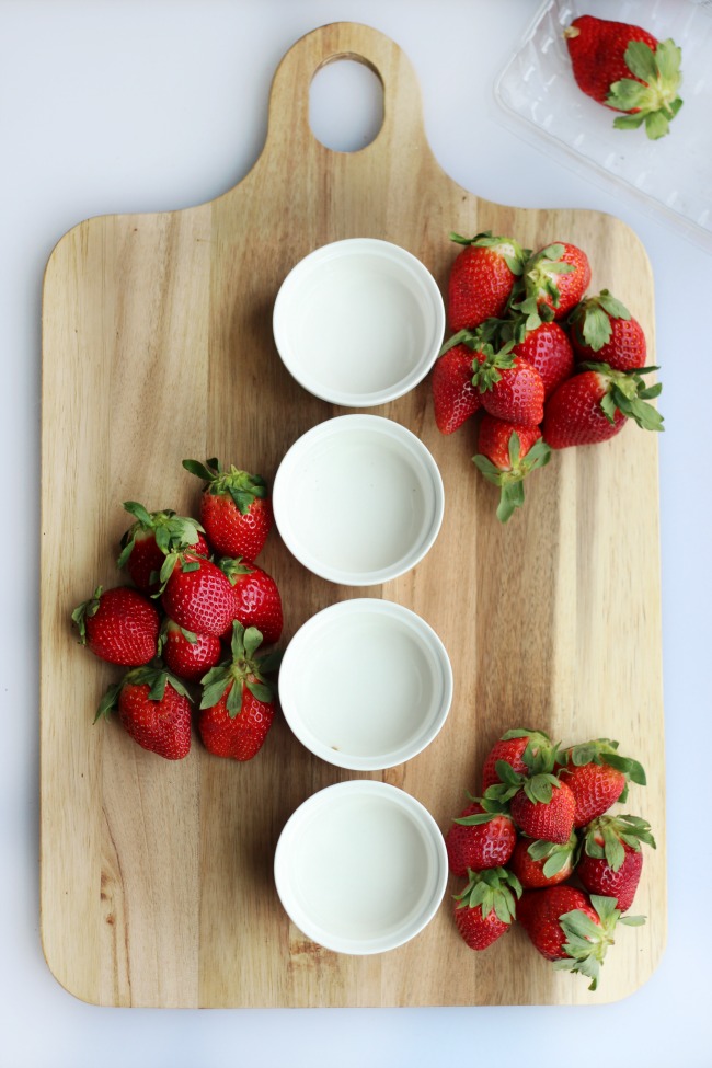 A simple and sweet chocolate dessert board with fruit! Perfect for a gathering! Strawberries, grapes, apples and two types of chocolate.