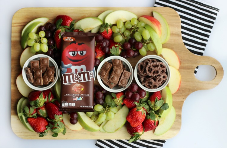 A simple and sweet chocolate dessert board with fruit! Perfect for a gathering! Strawberries, grapes, apples and two types of chocolate.