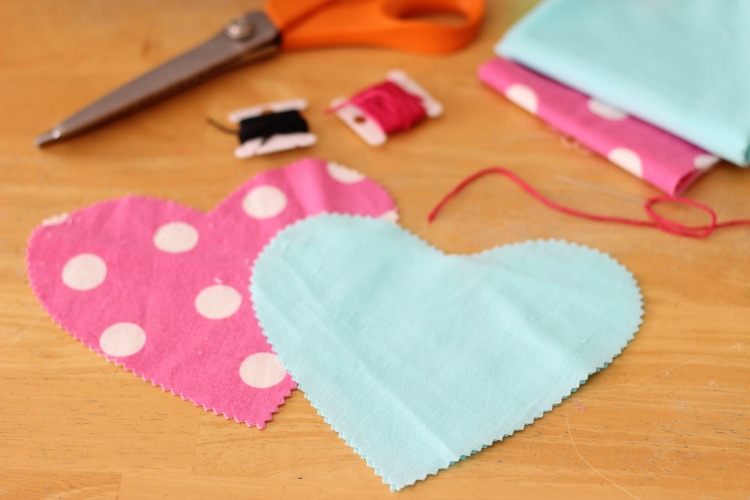 These DIY heart plushies come together quickly, and are a great beginning sewing project for kids! Fill with stuffing, dried lavender or beans!