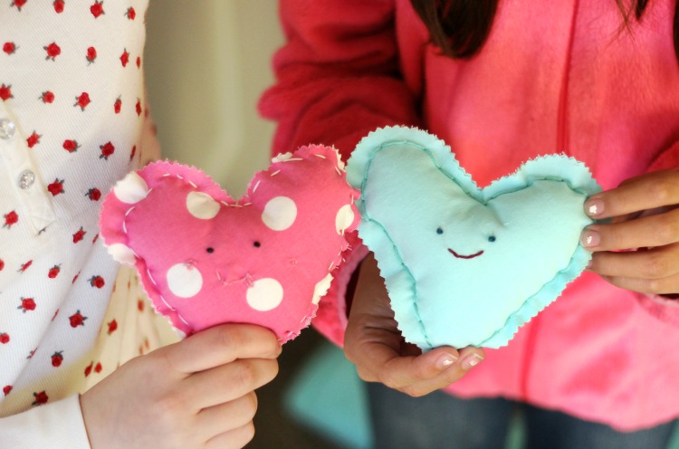 These DIY heart plushies come together quickly, and are a great beginning sewing project for kids! Fill with stuffing, dried lavender or beans!