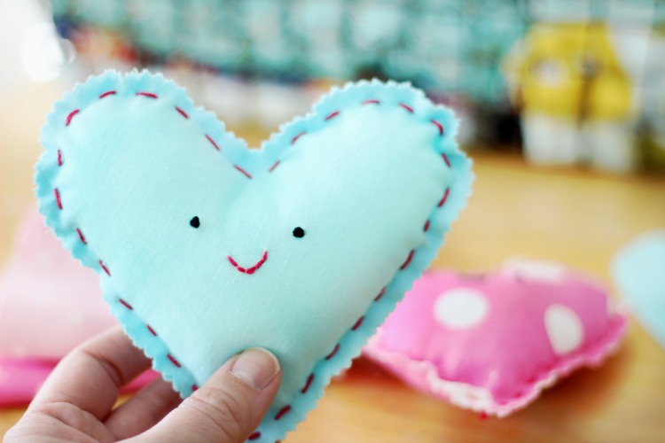 These DIY heart plushies come together quickly, and are a great beginning sewing project for kids! Fill with stuffing, dried lavender or beans!