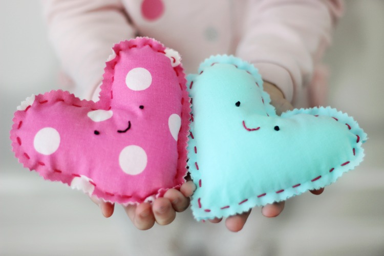 These DIY heart plushies come together quickly, and are a great beginning sewing project for kids! Fill with stuffing, dried lavender or beans!