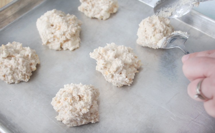 biscuit dough dropped onto baking sheet in balls