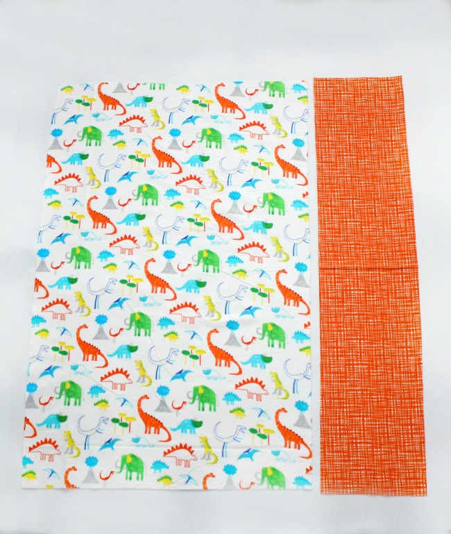 A free dinosaur pillowcase pattern available in travel, kid, or standard size! So cute and easy to customize. A great beginner sewing project.