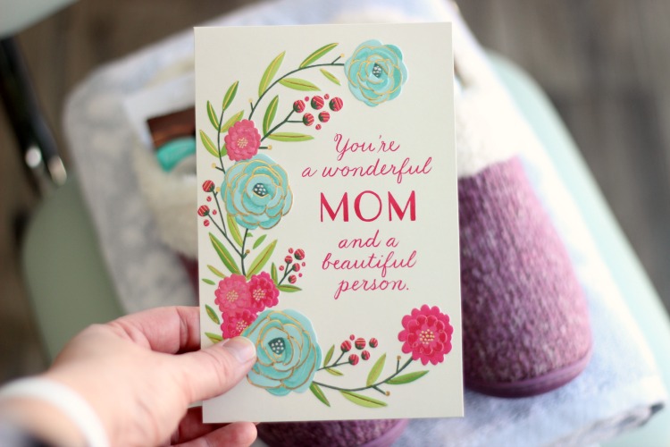 hand holding Mother's Day card 