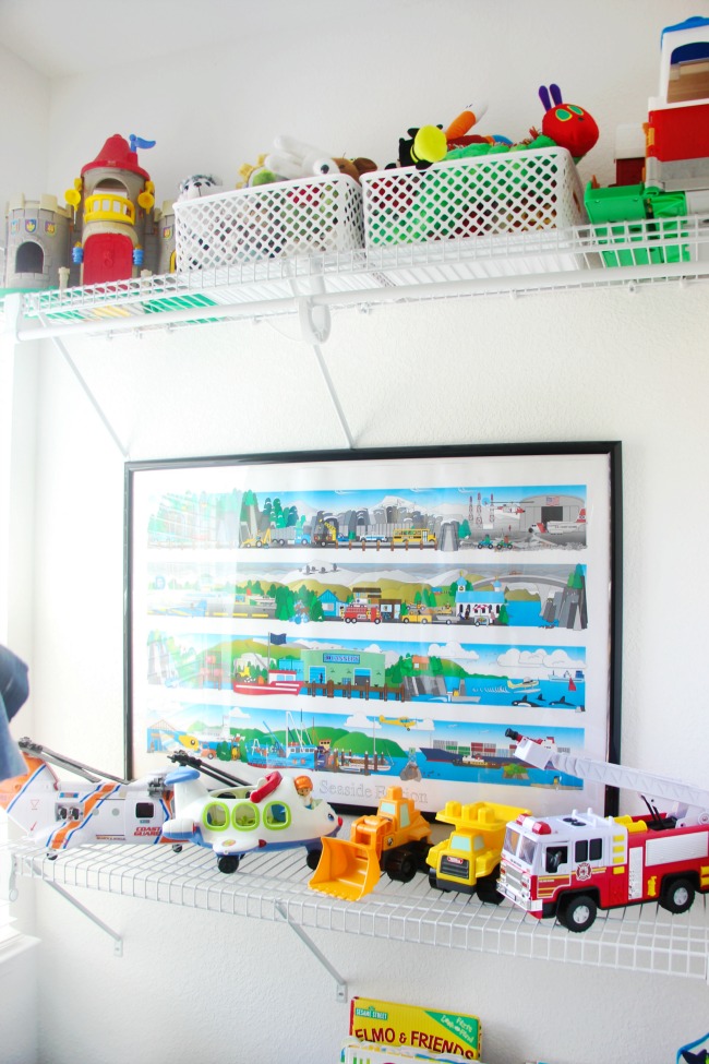 vehicle toys on shelf in creative toddler bedroom