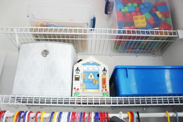 shelving with bins of toys