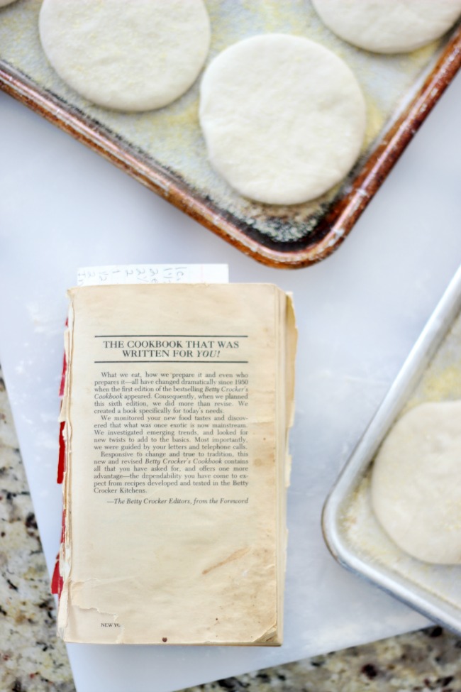 old cookbook on cutting board