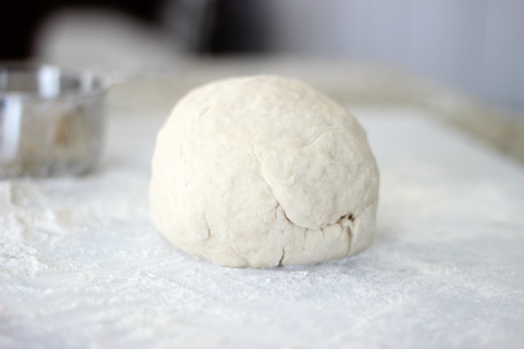  english muffins dough on floured board