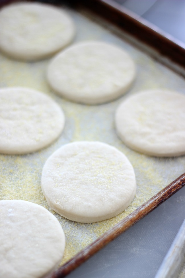 english muffins sitting on baking sheet