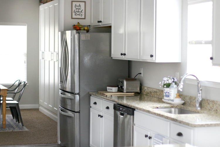 kitchen with refrigerator granite countertops and sink