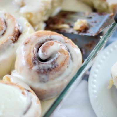 cinnamon rolls baked in pan with frosting
