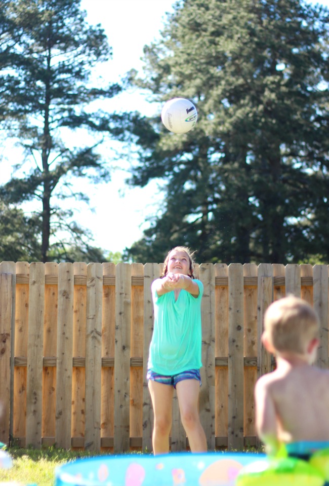 backyard activities for kids: girl playing volleyball