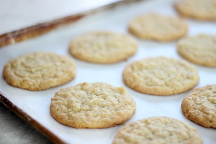 crispy coconut cookies on baking sheet