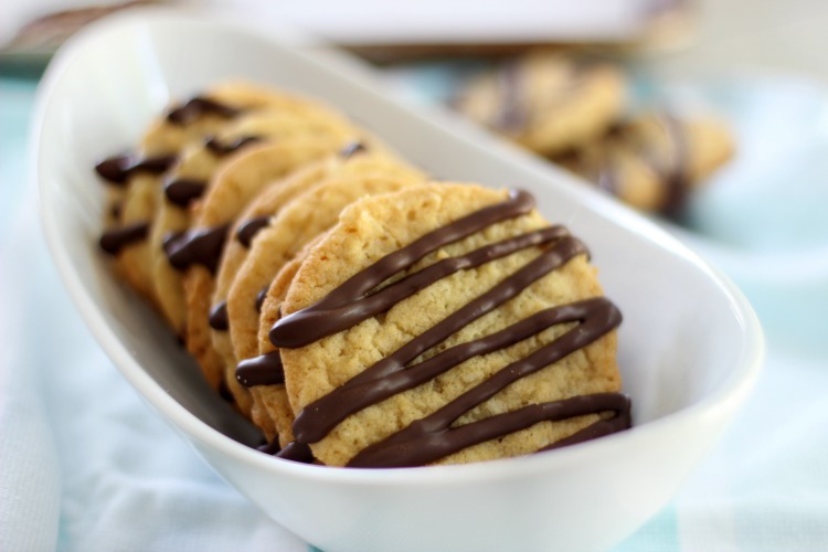 chocolate drizzled coconut cookies on serving platter