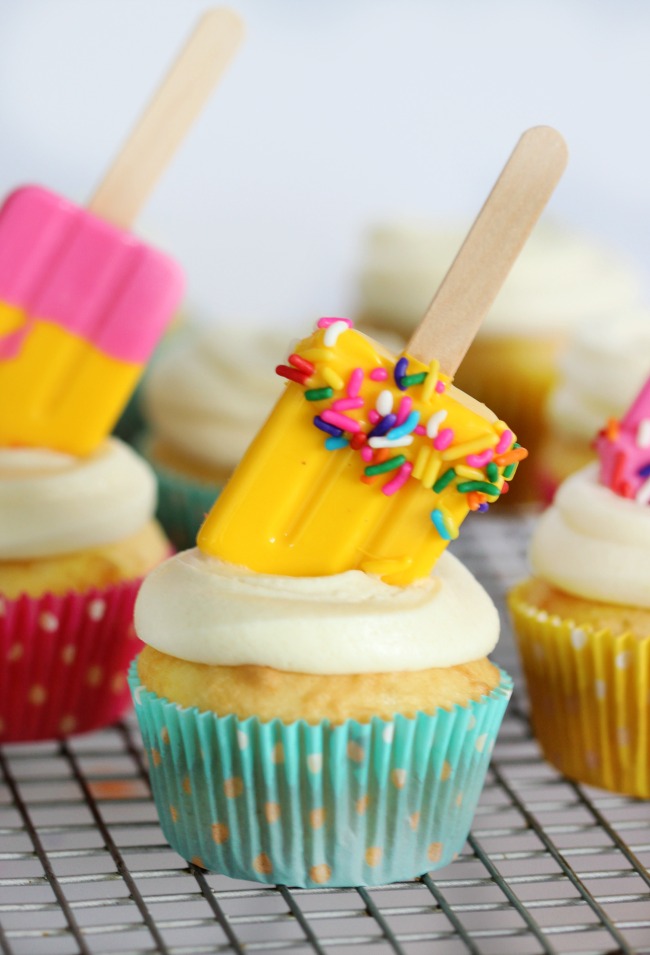 candy lollipop upside down on lemonade cupcake