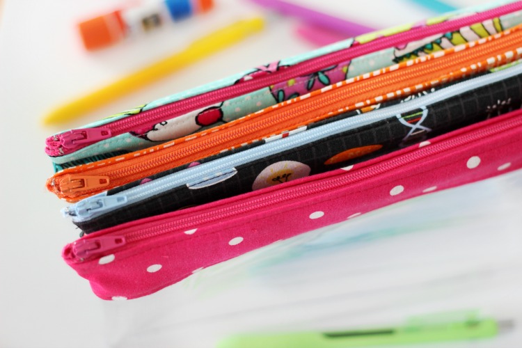 colorful zippers on vinyl pencil pouches