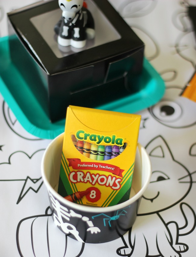 halloween coloring table cloth with a cup of crayons