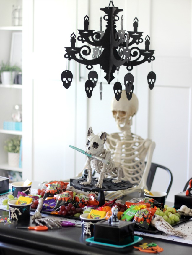 halloween party for kids with skeletons and art supplies