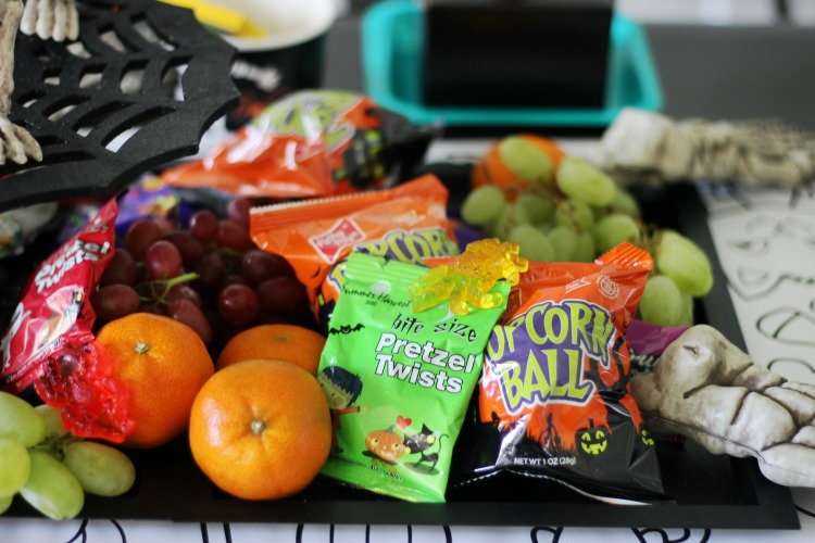 halloween pretzels, popcorn balls, gummy spiders and grapes