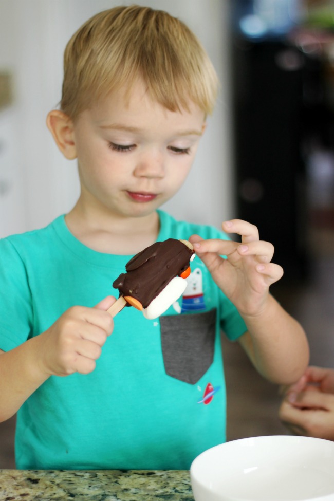 toddler making edible crafts chocolate penguin