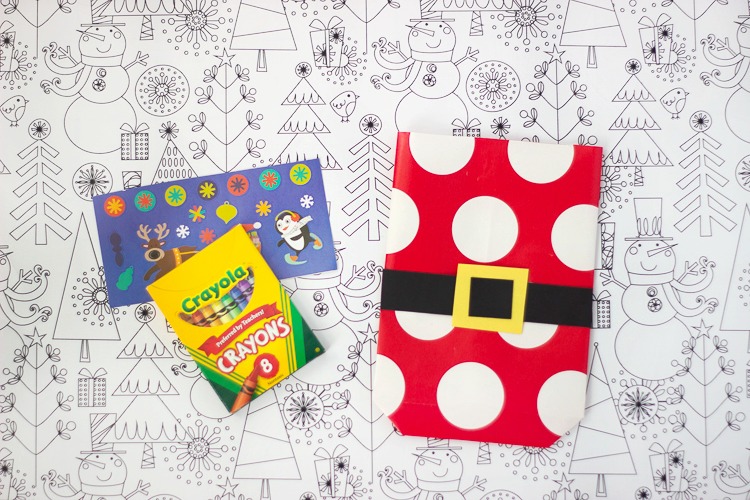 crayons and stickers to put inside wrapping paper bags