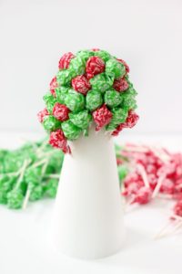 red and green lollipops in styrofoam cone