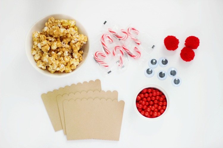 popcorn boxes, caramel popcorn, candy canes, candy, eyes pom poms