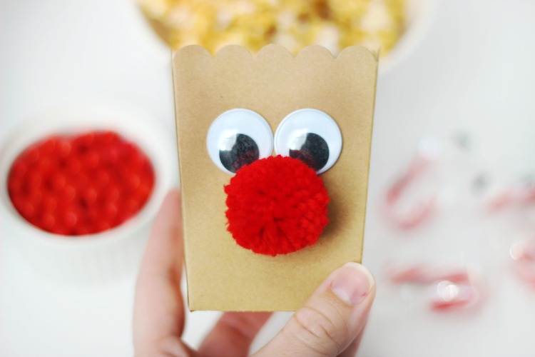 popcorn box with eyes and red nosed glued on front