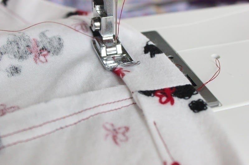 Waistband being sewn with sewing machine.
